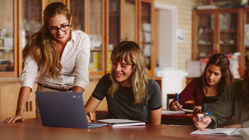 Windows apps for teachers teacher helping female student acer 